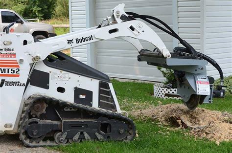 removing stumps with a skid steer|best skid steer stump grinder.